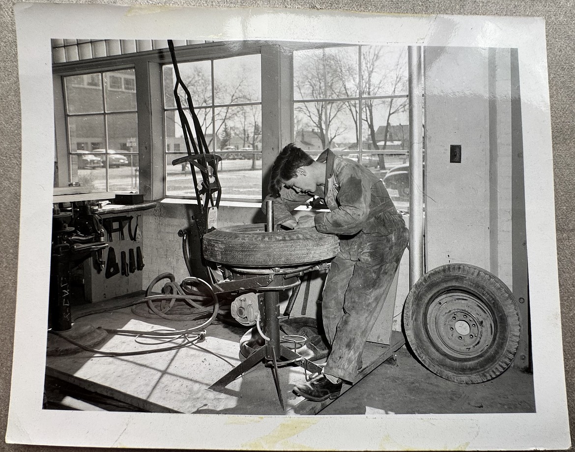 An old photo of a Flathead County High School student changing a tire in the auto mechanic shop on April 10, 1958. The automotive program marks its 75th anniversary this year at Flathead High School. (Hilary Matheson/Daily Inter Lake)