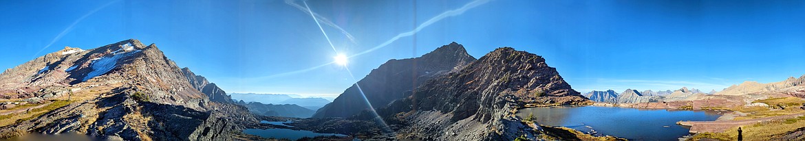 A panoramic view from the top of Comeau Pass shows shade in the west and brightness in the east on Oct. 12. (Kelsey Evans/Whitefish Pilot)