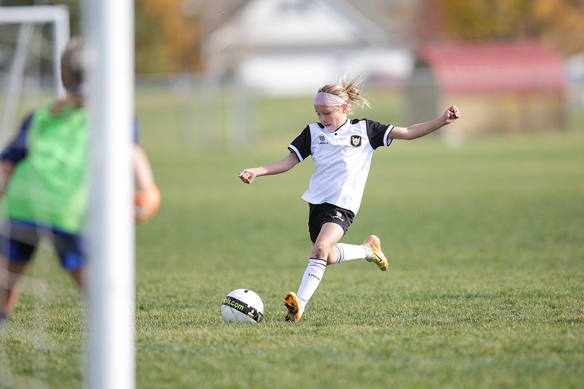 Photo by BUSCEMA PHOTOGRAPHY
On Saturday, Oct. 19, the Sting SC Yellow 14 Girls soccer team earned a 4-1 win over Spokane Shadow Rave. Allison Legg and Stella Hartzell each scored once for the Sting, and Viper Barnes scored twice. The Sting will compete in their last game of this season this Saturday at home against Spokane Shadow Valley Shale. Pictured is Viper Barnes, scoring one of her two goals.