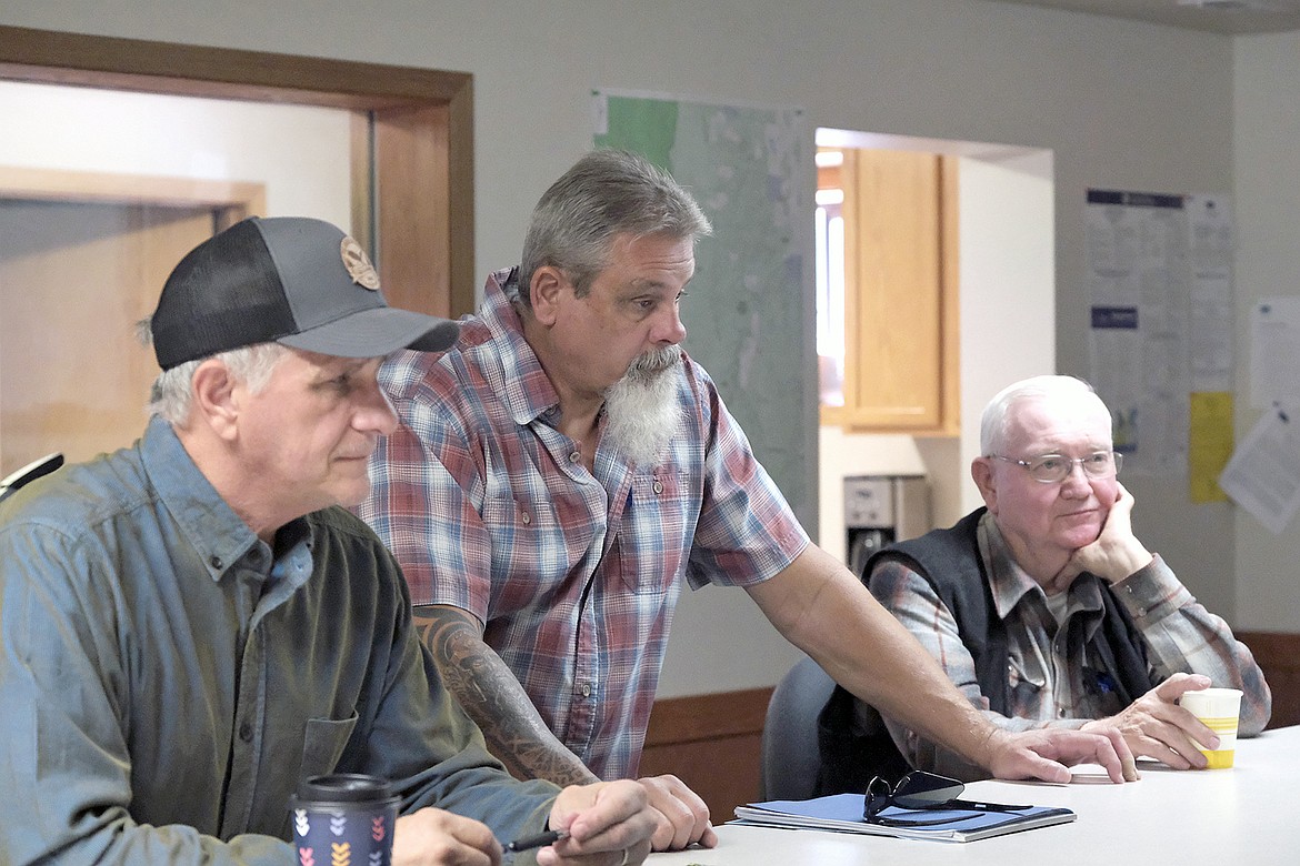 Bruce Vincent, Lincoln County Commissioner Brent Teske and state Sen. Mike Cuffe talk during a meeting Oct. 14, 2024, about the county's agreement with Kootenai National Forest for a Master Stewardship Agreement. (Paul Sievers/The Western News)