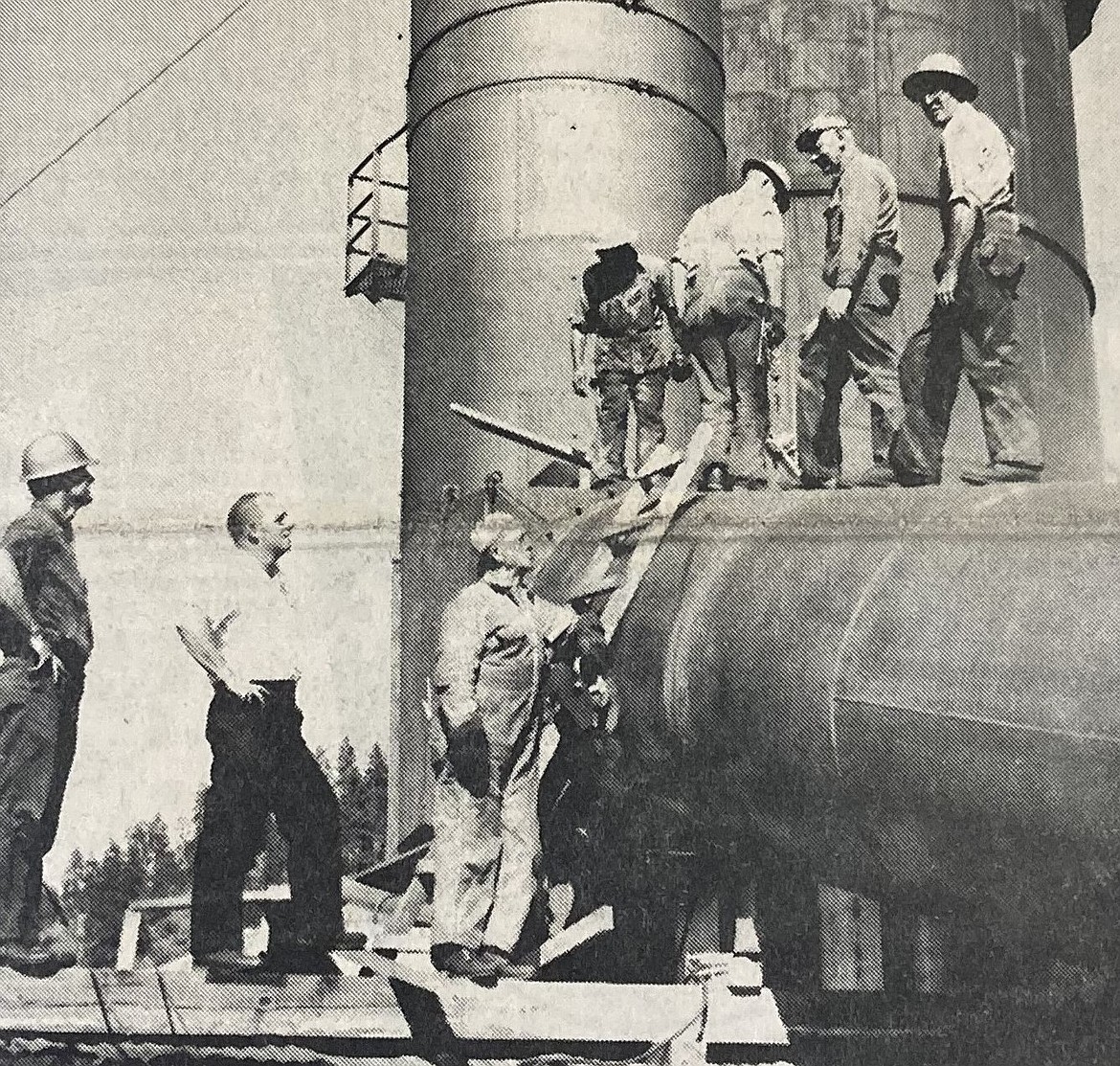 In 1964, workers install cinder control equipment at the Rutledge Mill. They are, from left, safety inspector Gene Jolin, plant superintendent Gardner Teall, welder Calvin Sullenberger, Roland Rotmark, Art Prambus, Henry Janusch and Fred Enders.