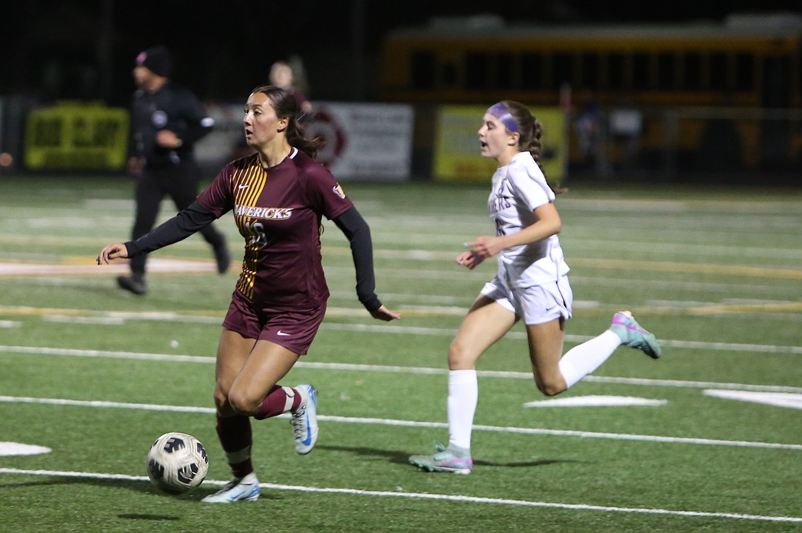 Moses Lake sophomore Kamery Char (16) searches for an open teammate while bringing the ball up the field against Wenatchee on Tuesday.