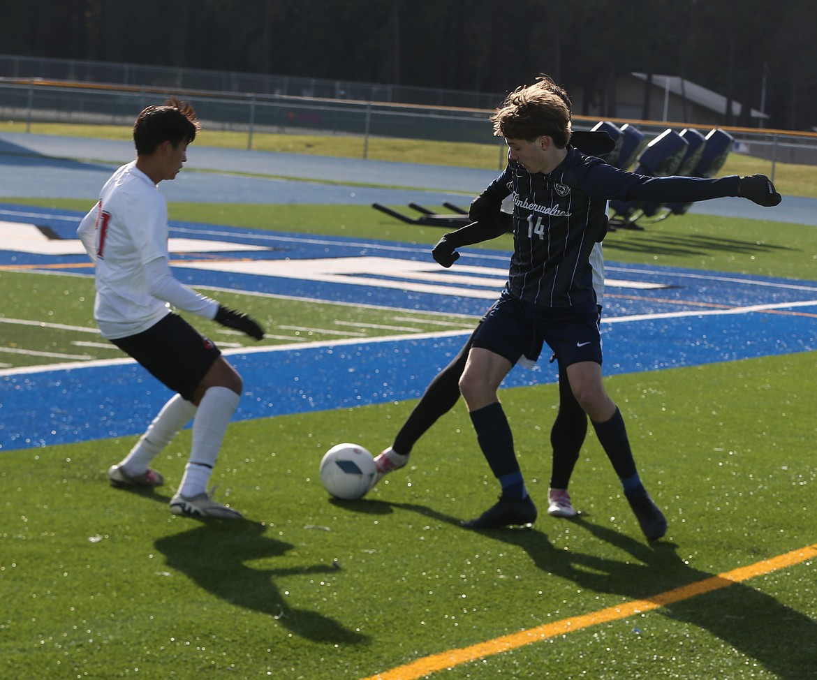 JASON ELLIOTT/Press
Lake City sophomore midfielder Oliver Soumis battles with Owyhee senior defender Brady Greenwald (21) during the second half of Thursday's state 6A opening round match at Viking Field.