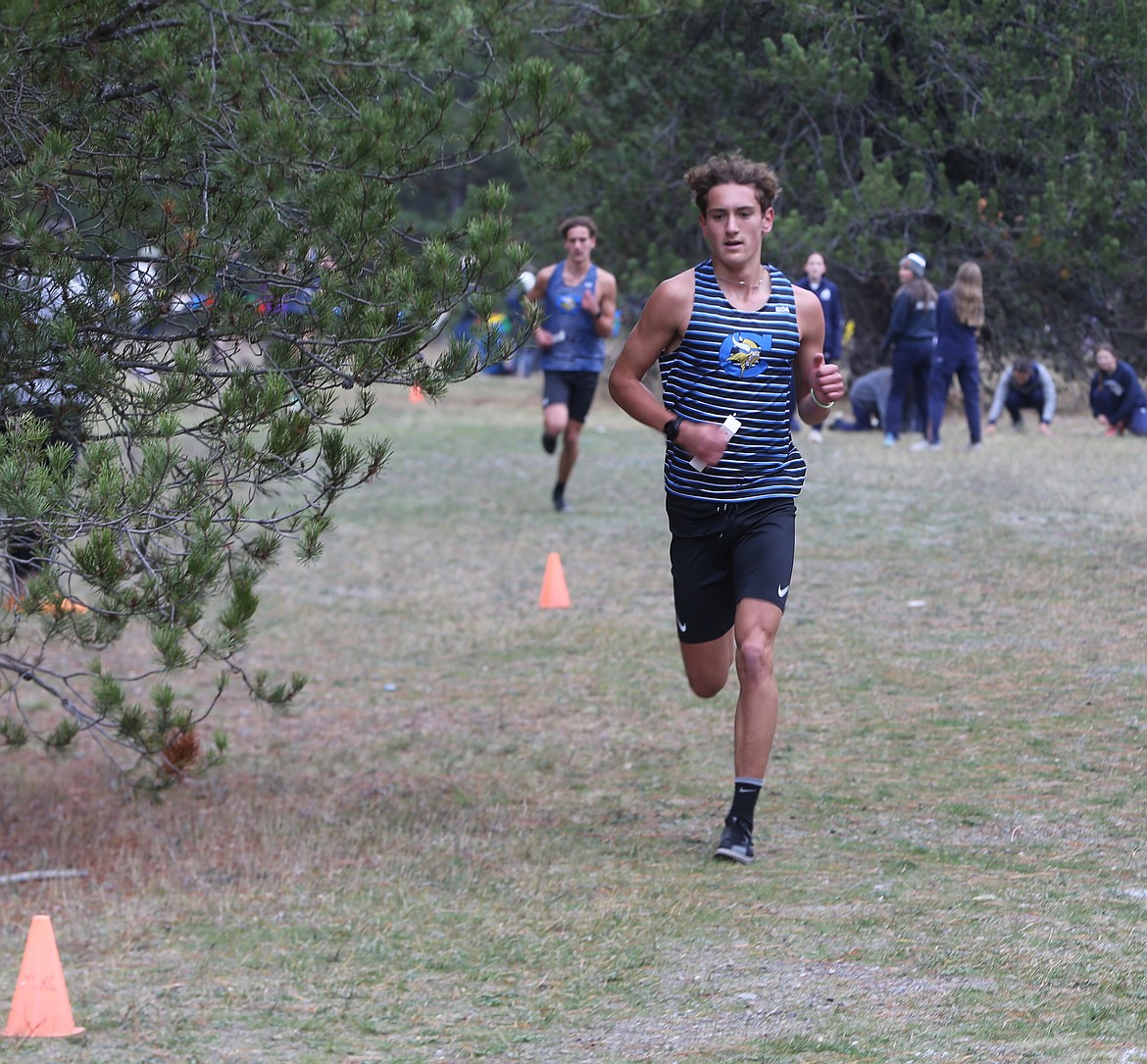 JASON ELLIOTT/Press
Coeur d'Alene senior Max Cervi-Skinner increases his lead on the second lap of the 6A District 1 boys cross country race at Farragut State Park on Thursday.