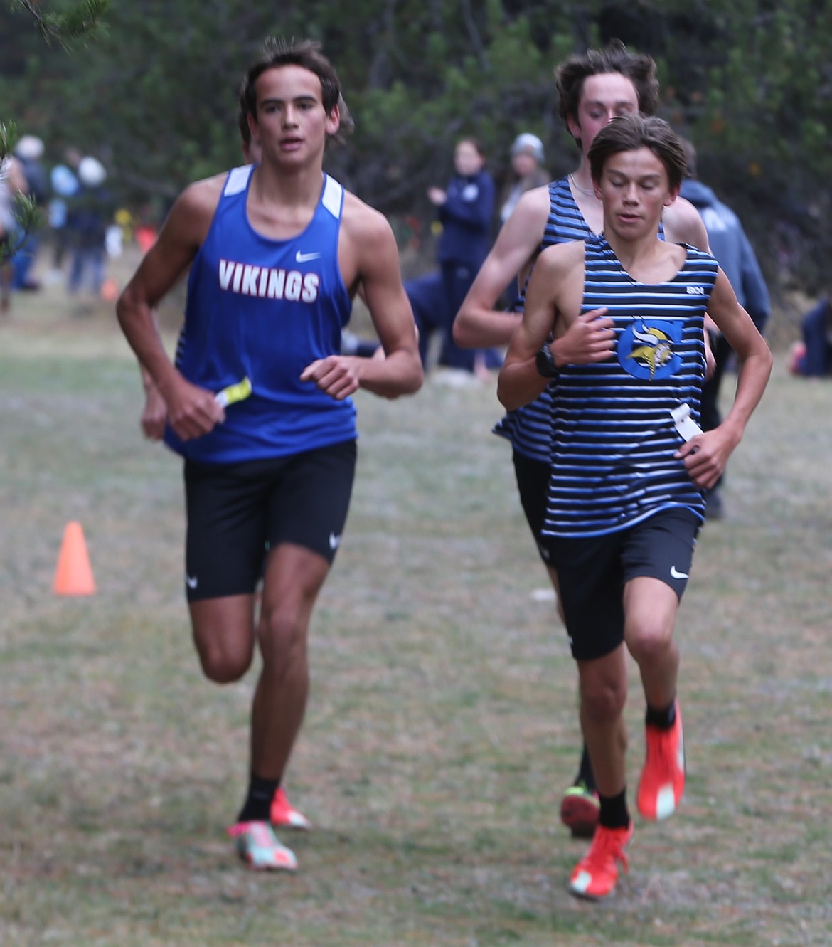 JASON ELLIOTT/Press
Coeur d'Alene junior Mitchell Rietze keeps up with fellow Viking Wyatt Morgenstern on the second lap of the 6A District 1 boys cross country race at Farragut State Park on Thursday.