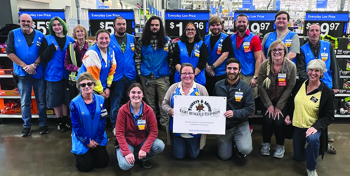 A wonderful crew from the Hayden Walmart store No. 3511 is happy about donating $1,000 to Turkeys & More to buy Thanksgiving turkeys. President Nancy Nelson on the right side of picture said it is exciting that only $20,000 more needs to be raised toward the goal of buying 2,000 birds. She anticipates over 10,000 people from vulnerable families will enjoy a more joyous meal in their homes for this special holiday. She thanks the Walmart store for donating again this year and encourages others who want to support this annual community event to send a check to Turkeys & More, P.O. Box 267, Coeur d'Alene, ID 83816. Donations can be safely made online at turkeysandmore.org. Those interested in pre-registering to pick up their turkeys at the November distribution should go to the Community Action Partnership (CAP) Food Bank in the Industrial Park off Atlas Road. The rest of the turkeys will be taken by the Coeur Group to other food banks and social service agencies who will pass them out in Kootenai County.