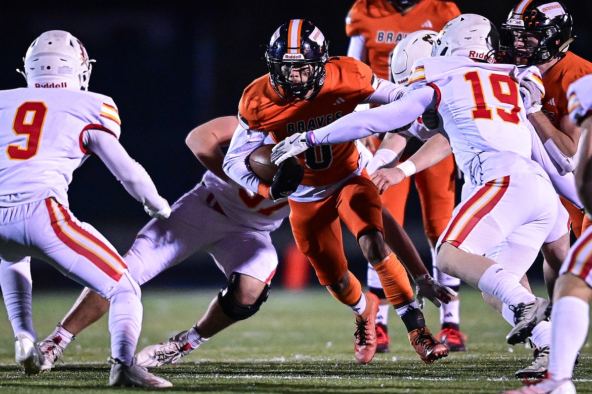 Flathead running back Tim Zundel (0) looks for running room in the first quarter against Missoula Hellgate at Legends Stadium on Friday, Oct. 25. (Casey Kreider/Daily Inter Lake)