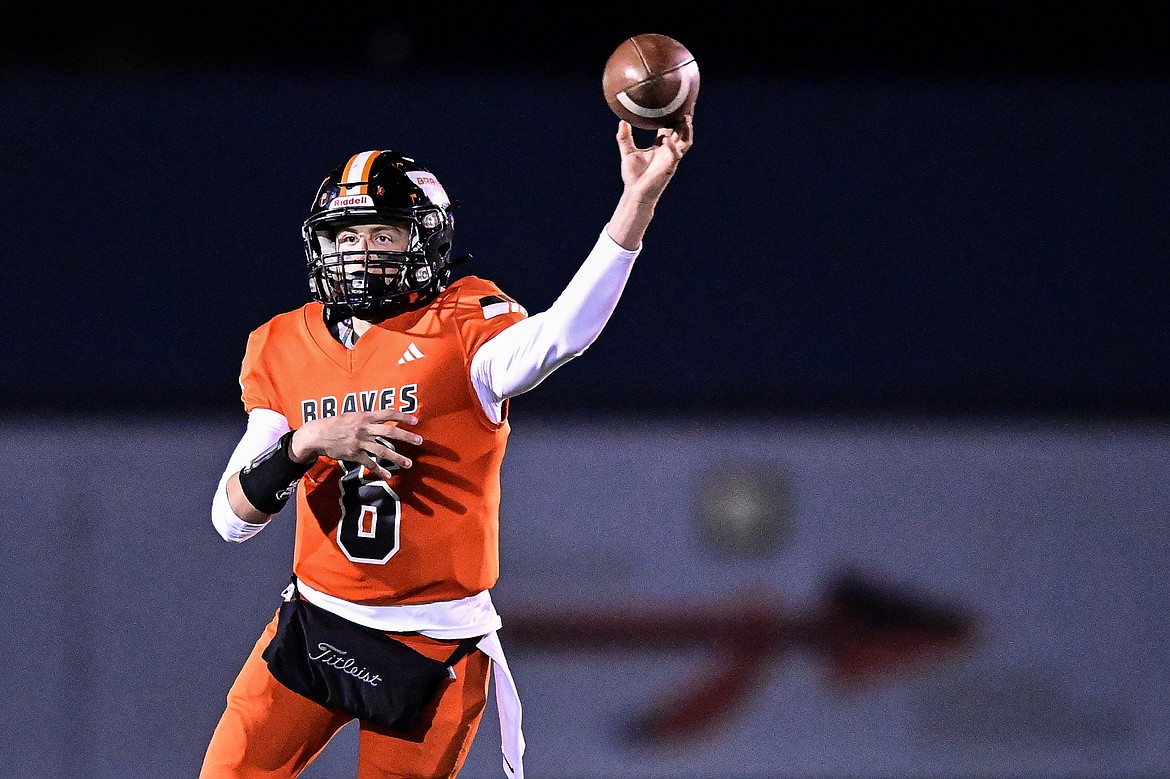 Flathead quarterback Eli Coopman (6) rolls out to pass in the fourth quarter against Missoula Hellgate at Legends Stadium on Friday, Oct. 25. (Casey Kreider/Daily Inter Lake)