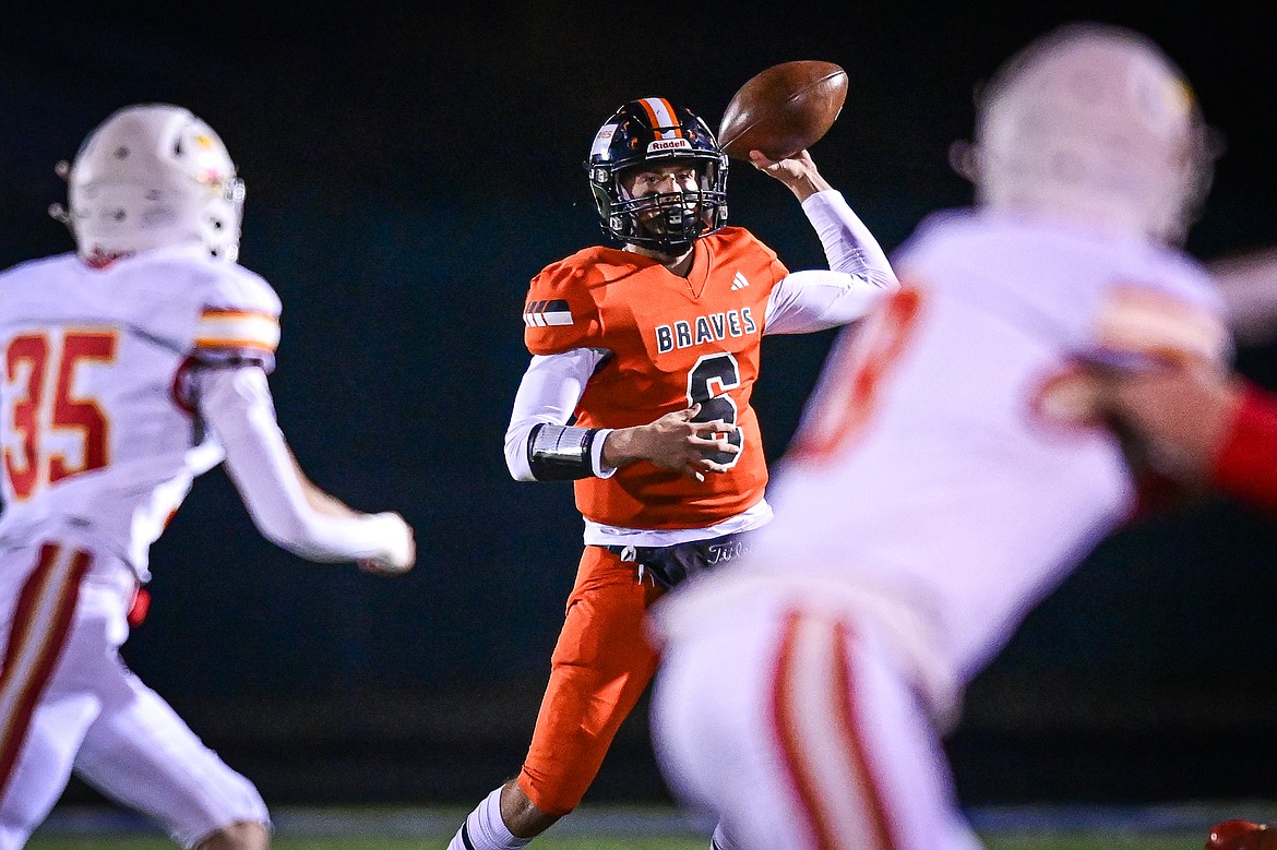 Flathead quarterback Eli Coopman (6) rolls out to pass in the first quarter against Missoula Hellgate at Legends Stadium on Friday, Oct. 25. (Casey Kreider/Daily Inter Lake)