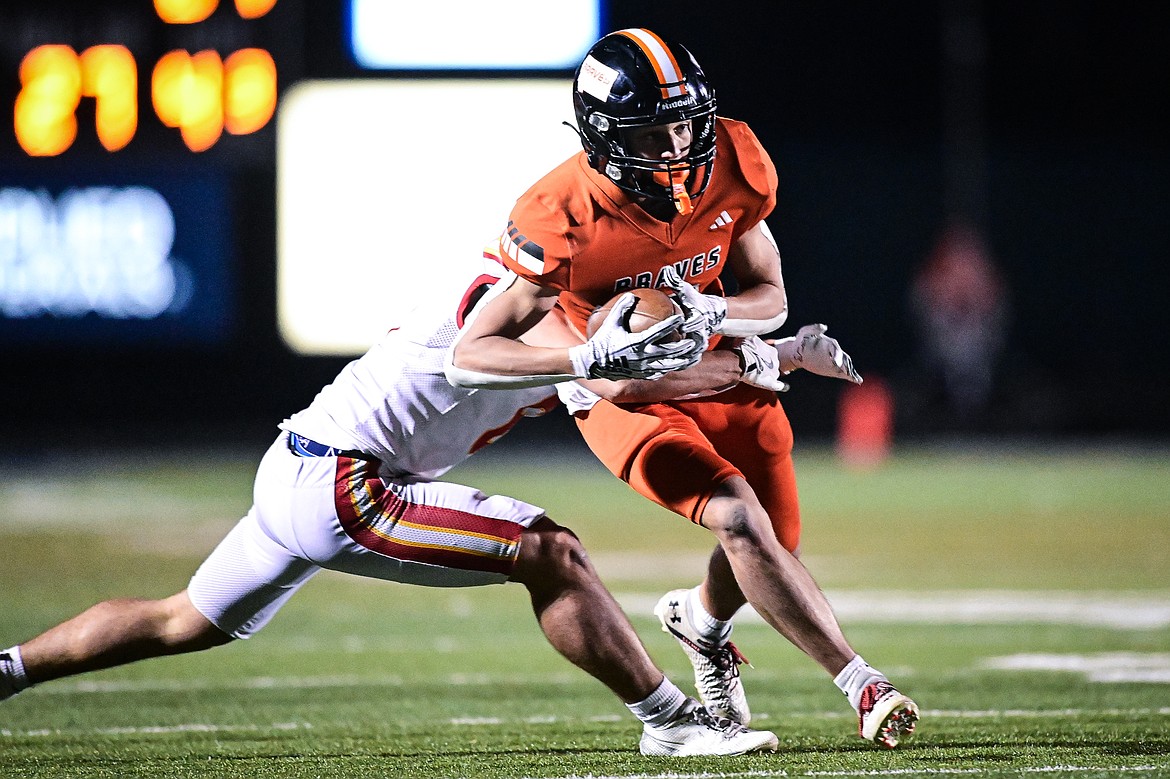 Flathead wide receiver Kaleb Sims (5) picks up yardage after a reception in the fourth quarter against Missoula Hellgate at Legends Stadium on Friday, Oct. 25. (Casey Kreider/Daily Inter Lake)