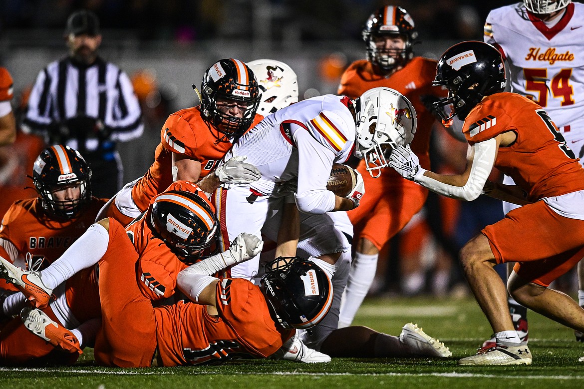 Flathead defenders stops a run by Missoula Hellgate wide receiver Parker Link (3) in the first quarter at Legends Stadium on Friday, Oct. 25. (Casey Kreider/Daily Inter Lake)