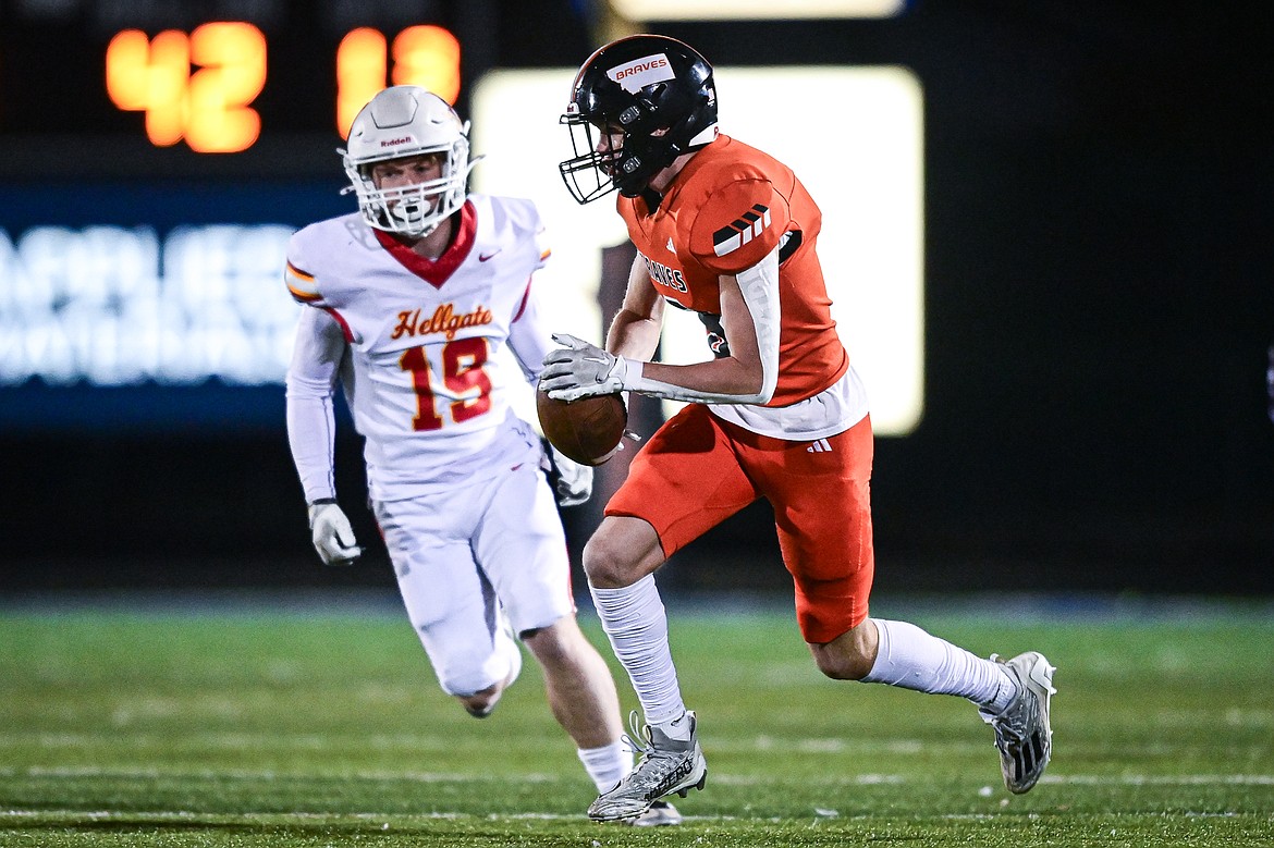 Flathead wide receiver Noah Sonju (8) picks up yardage after a reception in the first quarter against Missoula Hellgate at Legends Stadium on Friday, Oct. 25. (Casey Kreider/Daily Inter Lake)