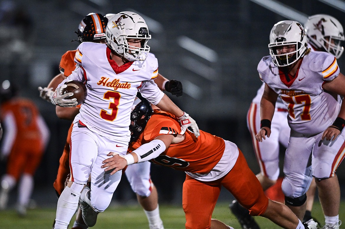 Hellgate wide receiver Parker Link (3) looks for running room in the first quarter against Flathead at Legends Stadium on Friday, Oct. 25. (Casey Kreider/Daily Inter Lake)