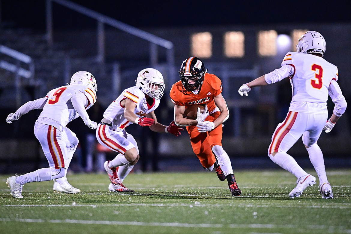 Flathead wide receiver Lane Chivers (3) picks up yardage after a reception in the first quarter against Missoula Hellgate at Legends Stadium on Friday, Oct. 25. (Casey Kreider/Daily Inter Lake)