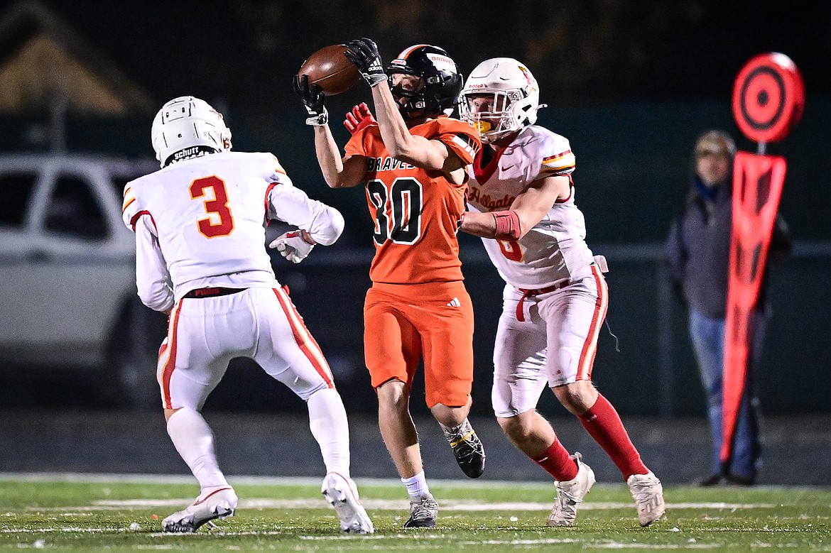 Flathead wide receiver Jack Blodgett (80) hangs on to a reception in the fourth quarter against Missoula Hellgate at Legends Stadium on Friday, Oct. 25. (Casey Kreider/Daily Inter Lake)