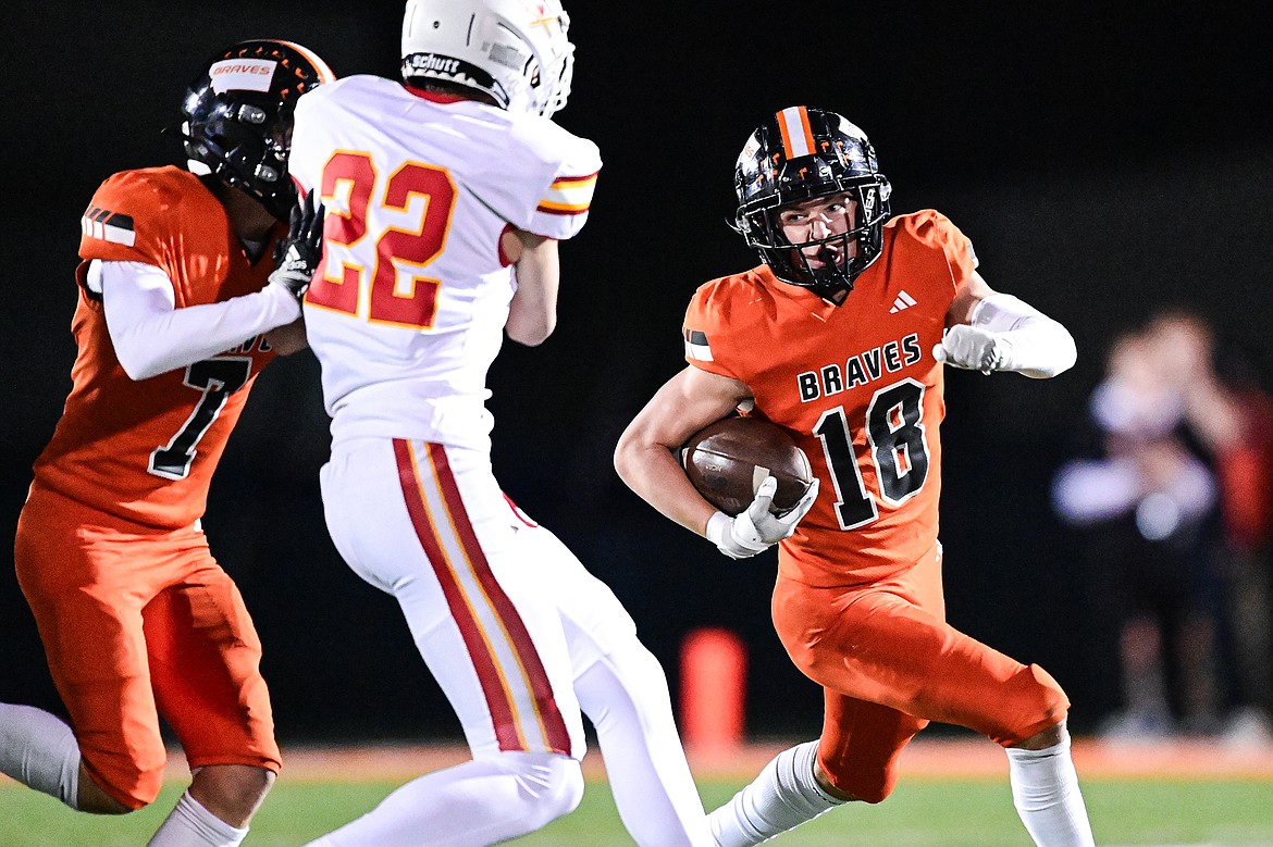 Flathead kick returner Dillon Wink (18) returns a kickoff in the third quarter against Missoula Hellgate at Legends Stadium on Friday, Oct. 25. (Casey Kreider/Daily Inter Lake)