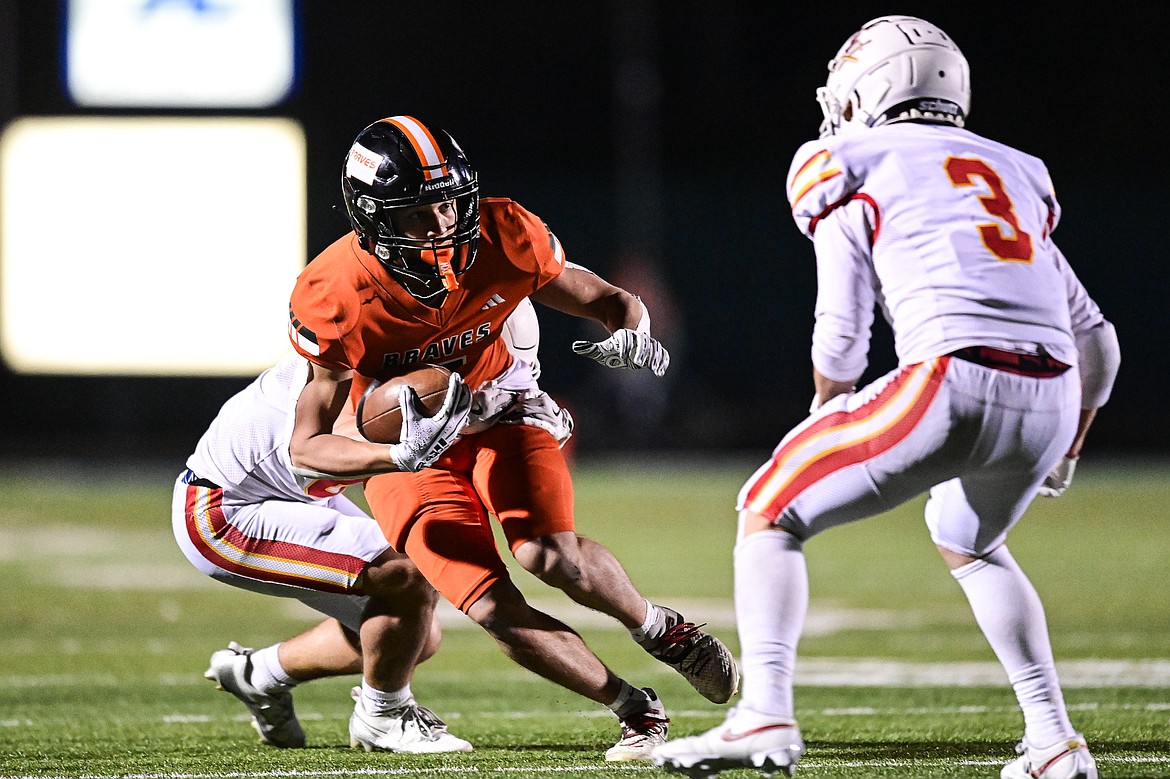 Flathead wide receiver Kaleb Sims (5) picks up yardage after a reception in the fourth quarter against Missoula Hellgate at Legends Stadium on Friday, Oct. 25. (Casey Kreider/Daily Inter Lake)