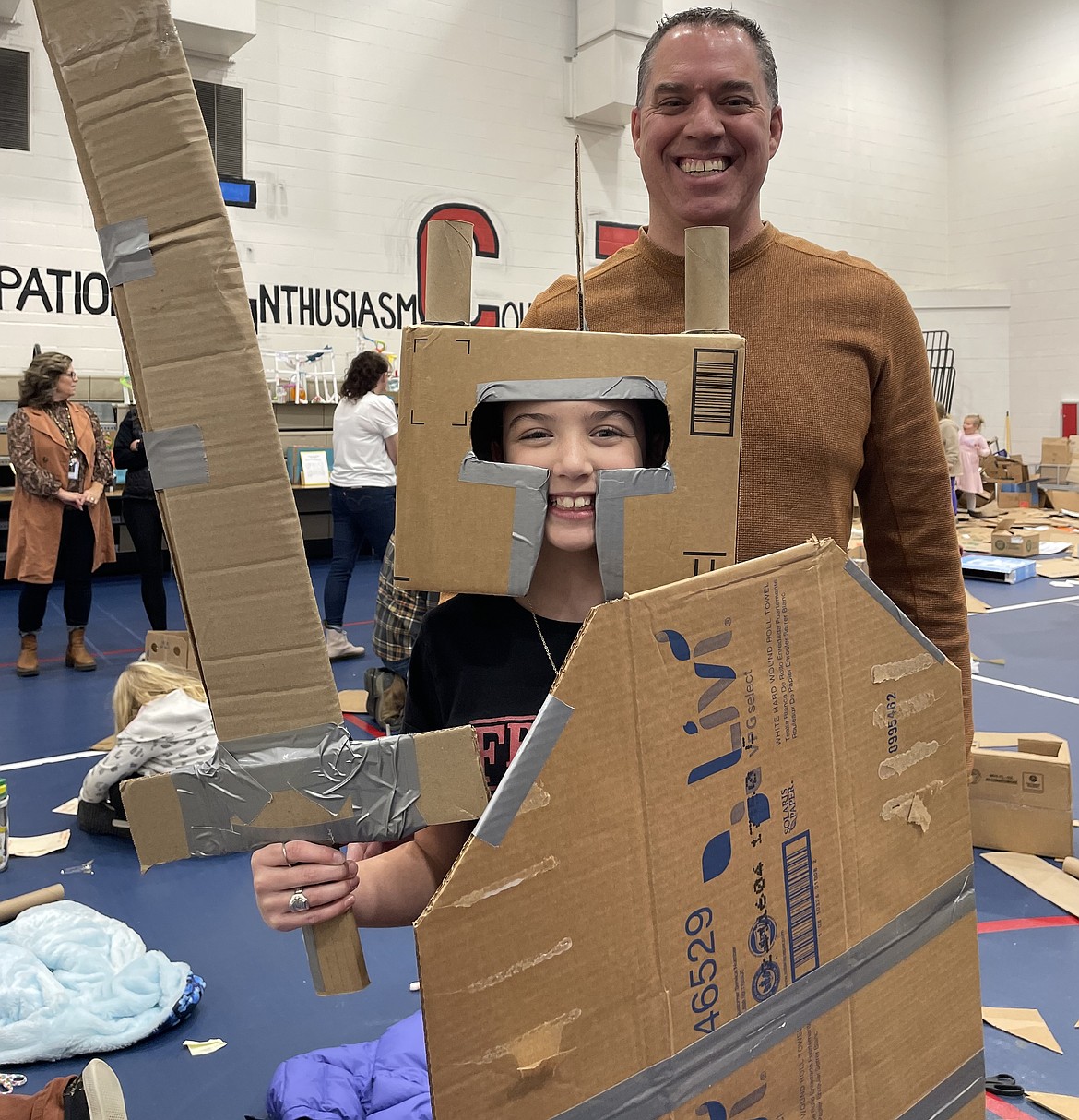 Ayla McKinzie, a Garwood Elementary School fifth grader, shows off her cardboard suit of armor Wednesday evening at the Cardboard Challenge at Twin Lakes Elementary School.