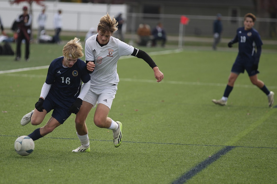 JASON ELLIOTT/Press
Coeur d'Alene Charter junior forward Joseph Nicklay attempts to get past Teton senior midfielder Isaac Thomas during the first half of Friday's state 4A boys soccer semifinal match at The Fields in Post Falls.