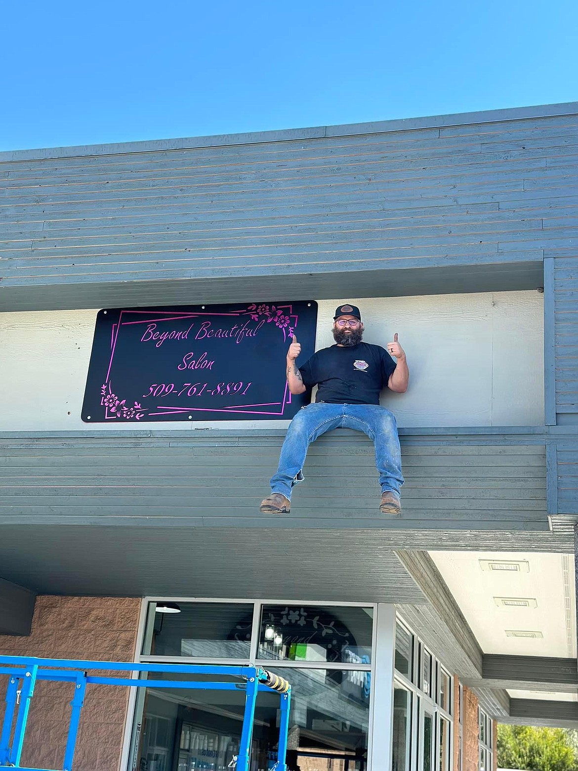 Seth Miner delivers a sign for Beyond Beautiful Salon. Miner owns Miner’s Services LLC and has made several signs for various businesses across Grant, Adams and Benton County.