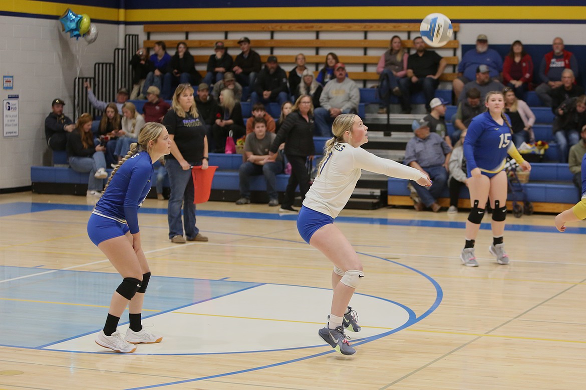 Wilson Creek senior Cassie Hinen, in white, receives a serve against Soap Lake on Thursday.