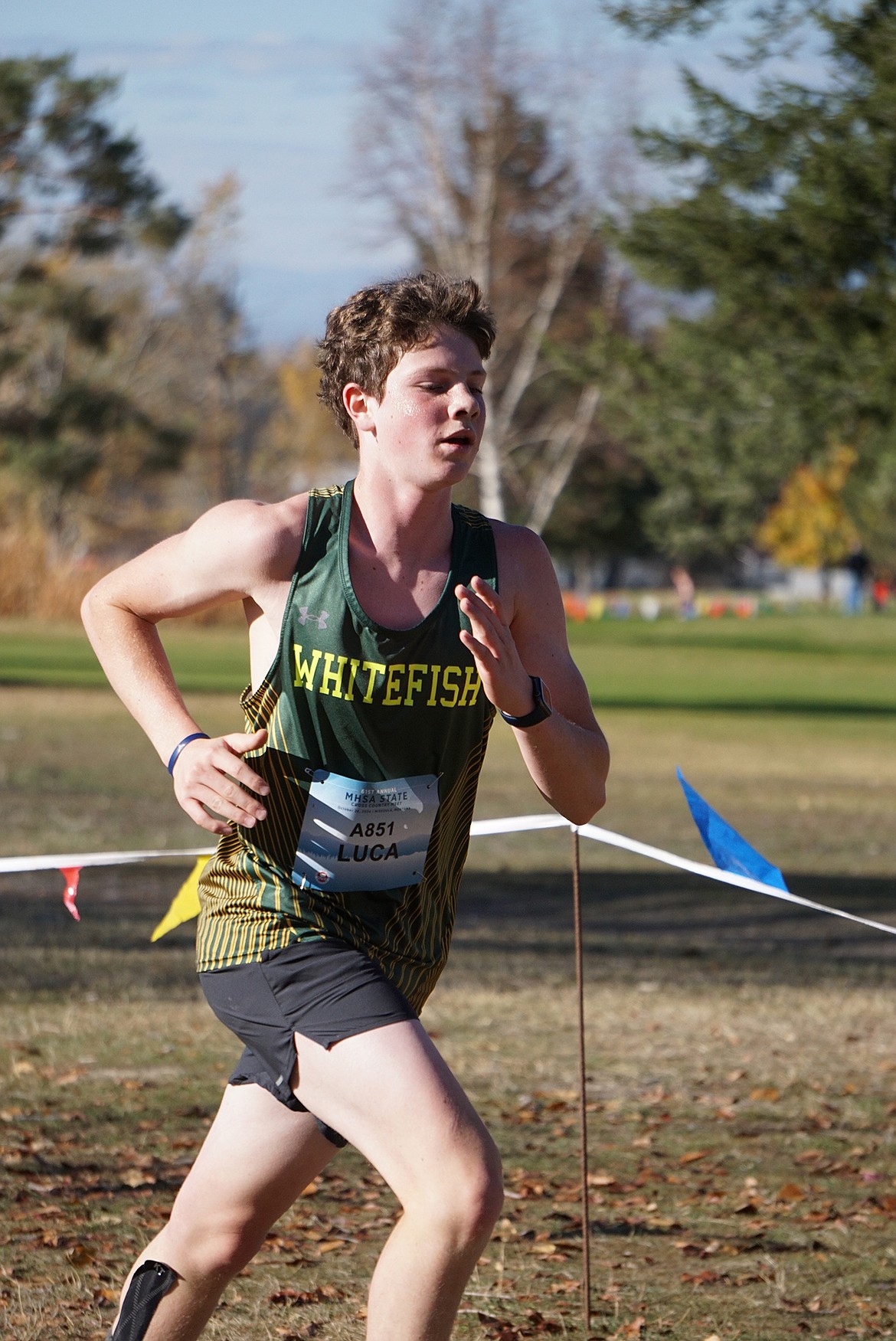 Freshman Bulldog, Luca Gignoux, accelerates towards the finish of the MHSA State Cross Country championship in Missoula on Saturday. (Matt Weller photo)