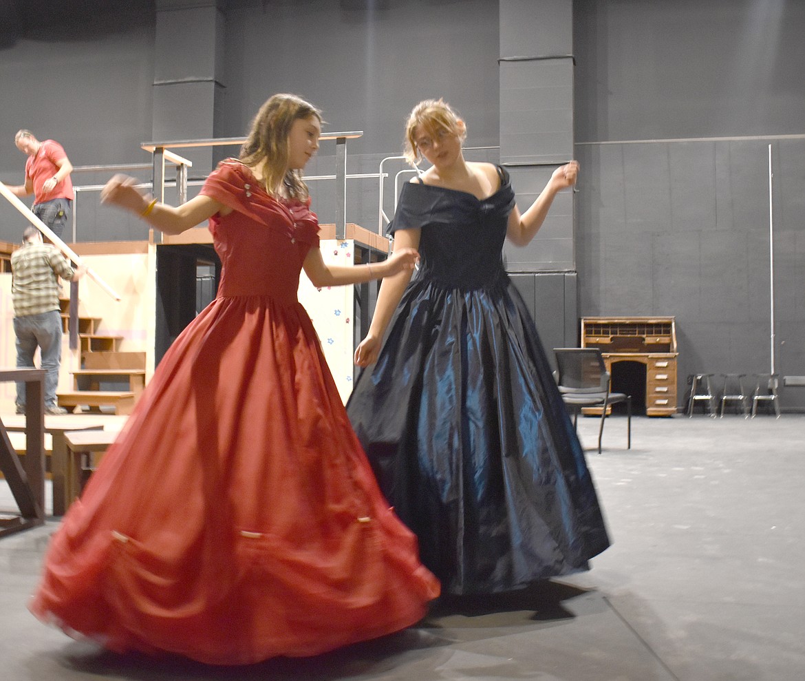 Amberlynn Godfrey, left, and Anjel Johnson demonstrate a dance they’ll be doing in a scene of the Quincy High School production of “Little Women.”