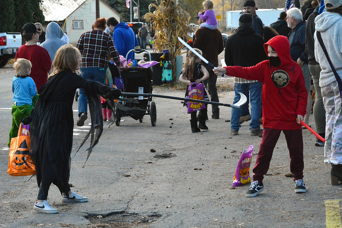 Just an innocent sword fight broke out in line waiting to play darts. (Mineral Independent/Amy Quinlivan)