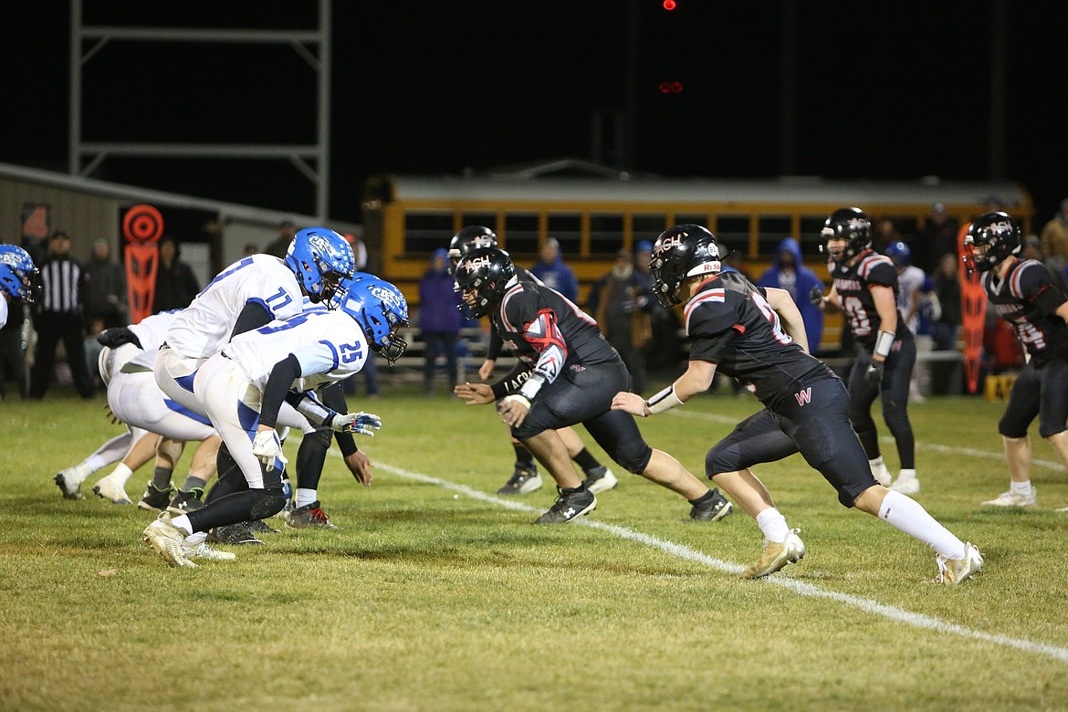 The Almira/Coulee-Hartline defense sets up for a play against Wilbur-Creston-Keller on Friday. ACH fell to 6-2 with the loss to the Wildcats.