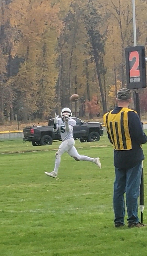 St. Regis senior Hunter Stolla watches the ball fall into his hands during the Tigers' game against Troy Saturday afternoon in Troy. (Photo by Ashley Fauble)