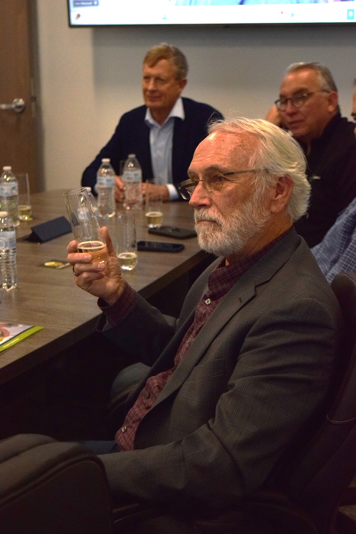 Republican Congressman Dan Newhouse samples the Golden Delicious cider from Endless Orchard at Okanagan Specialty Fruits Friday.