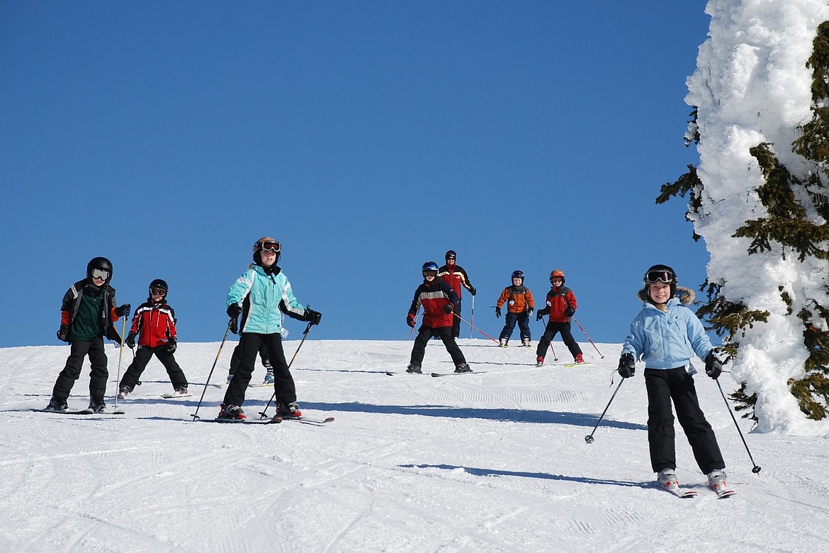 Participants in North Idaho Mountain Sports Education Fund's children's program cruise the slopes at Schweitzer. NIMSEF is one of many local organizations aiming to make skiing possible for all Sandpoint residents, regardless of income.