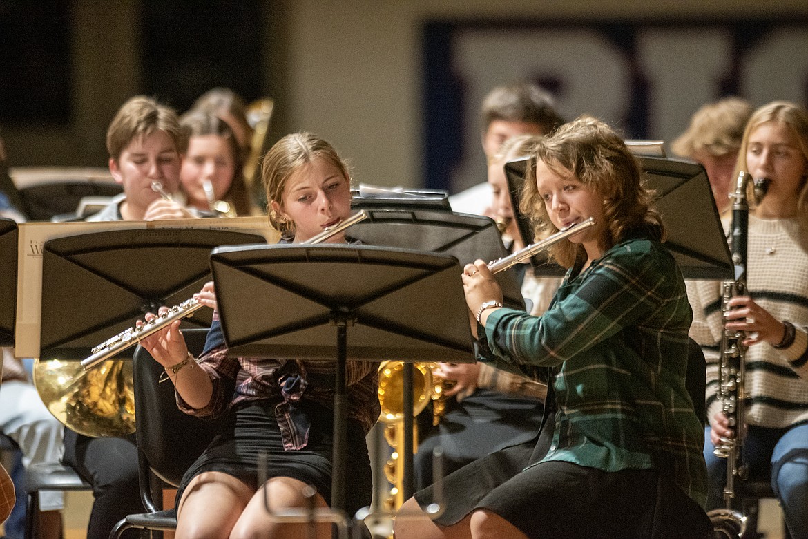 Eighth graders Marion Shanks and Audrey Corder plays flute in the Fall concert. (Avery Howe/Bigfork Eagle)