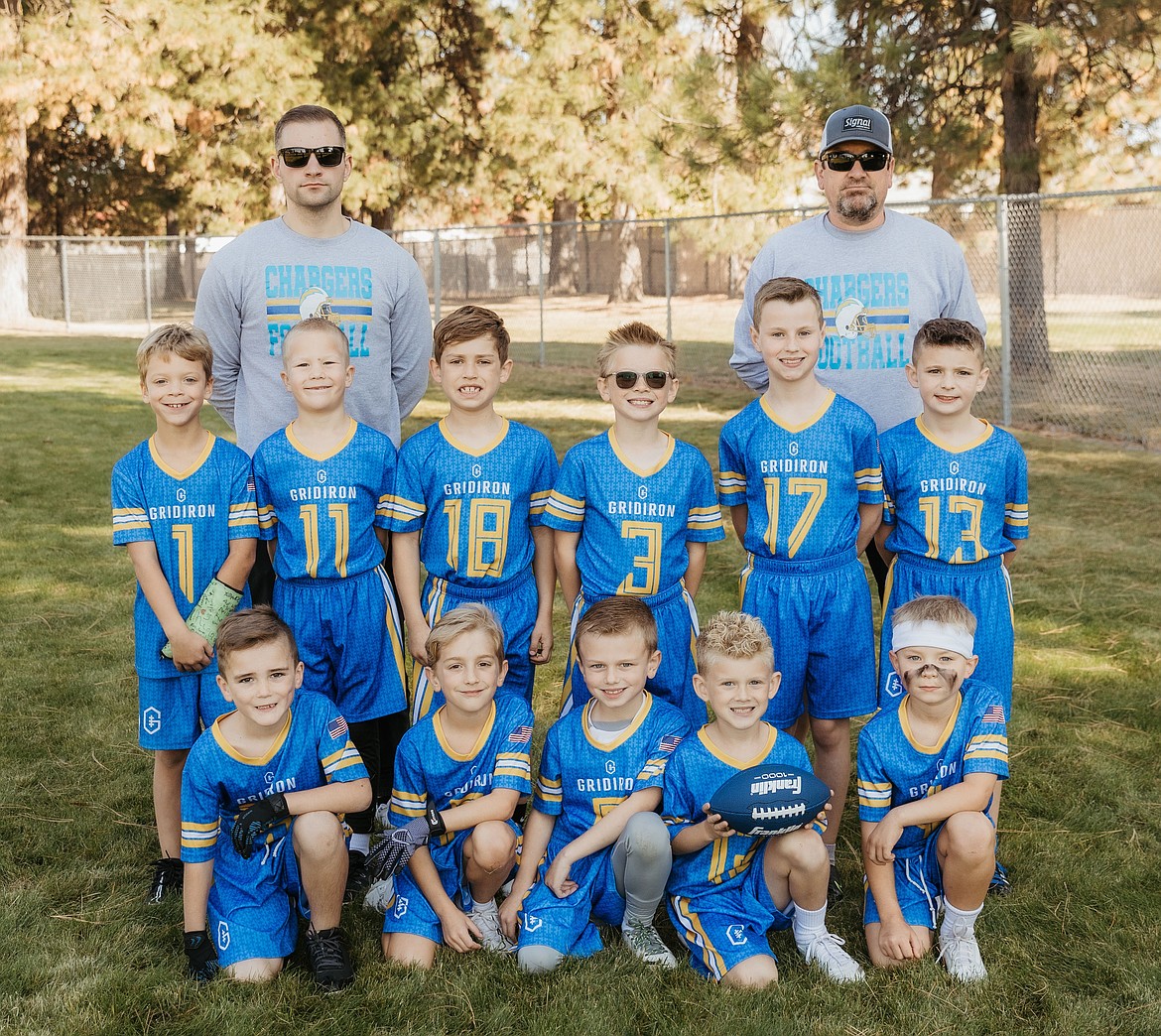 Courtesy photo
The Cd'A Chargers finished third in the recent Washington 2024 Gridiron Championship, taking their semifinal game to triple overtime before falling. In the front row from left are Kiptyn Keogh, Ben Cesarini, Maddux Capaul, Grey Gallia and Jaxon Forbush; second row from left, Roman Frisbie, Gus Walker, Luke Capaul, Carter McBroom, Hudson Capaul and Jaxson Brouse; and back row from left, coaches Tucker Forbush and Dave Cesarini.