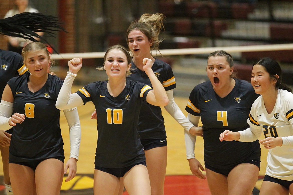 MARK NELKE/Press
From left, Madi Cooper (8), Ella Martin (10), Kennedy Prendergast, Kinzie Lawler (4) and Pearl Covey (20) celebrate a point during last Thursday's 2A District 1 volleyball championship match vs. Wallace at North Idaho College.