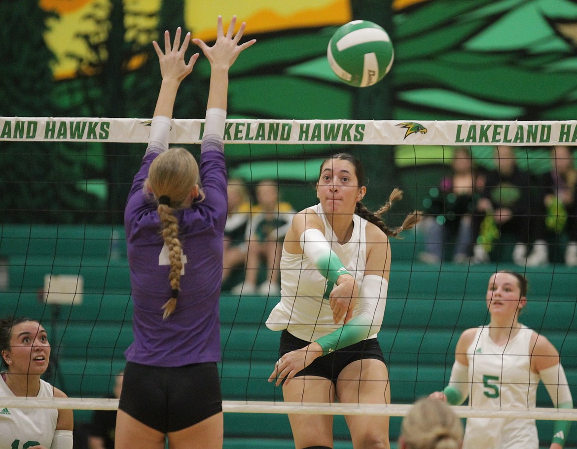 MARK NELKE/Press
Lakeland senior Ziya Munyer hits against Lewiston on Saturday night in the 5A Region 1 volleyball championship match in Rathdrum.