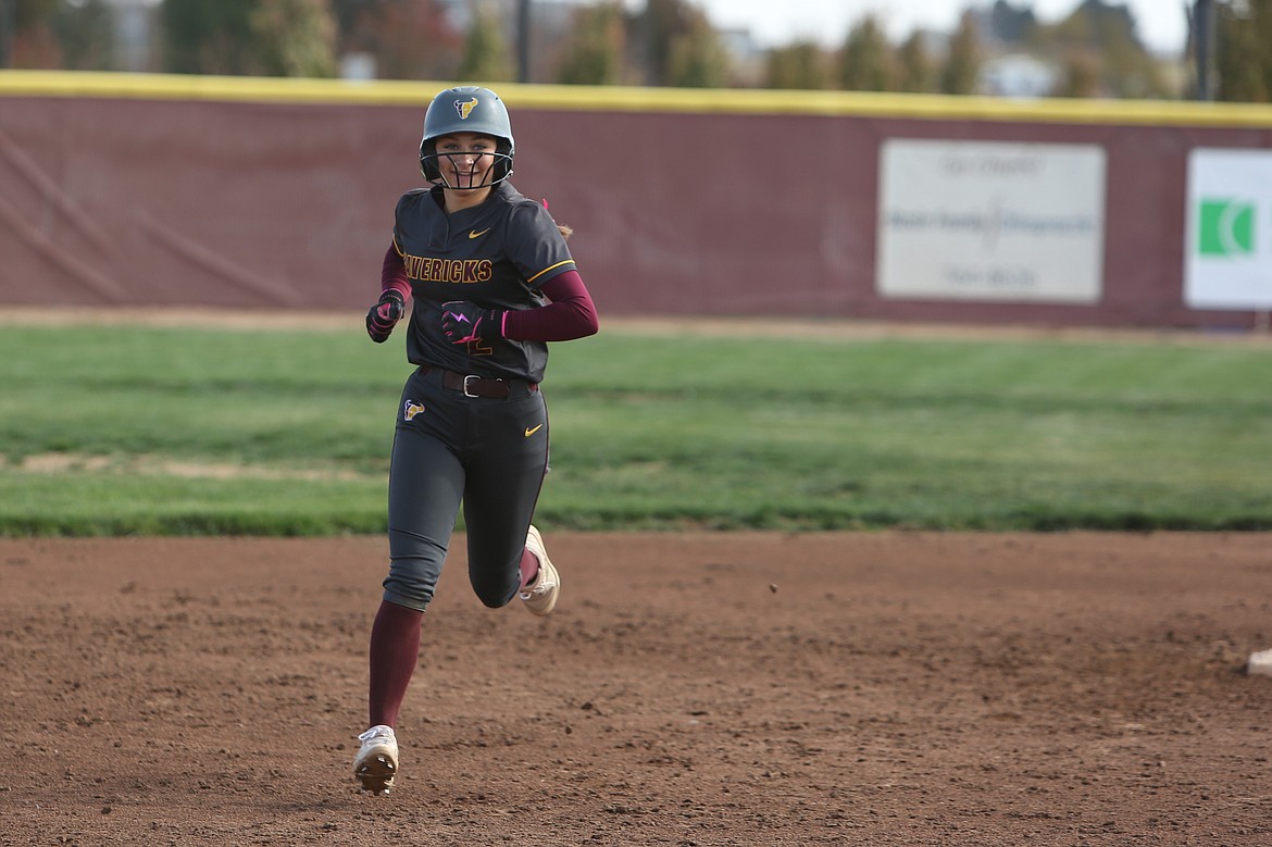 Moses Lake junior Hayden Morris smiles while running the bases after hitting a home run against Eastmont on Oct. 19. Morris hit two home runs against Mead in the semifinals.