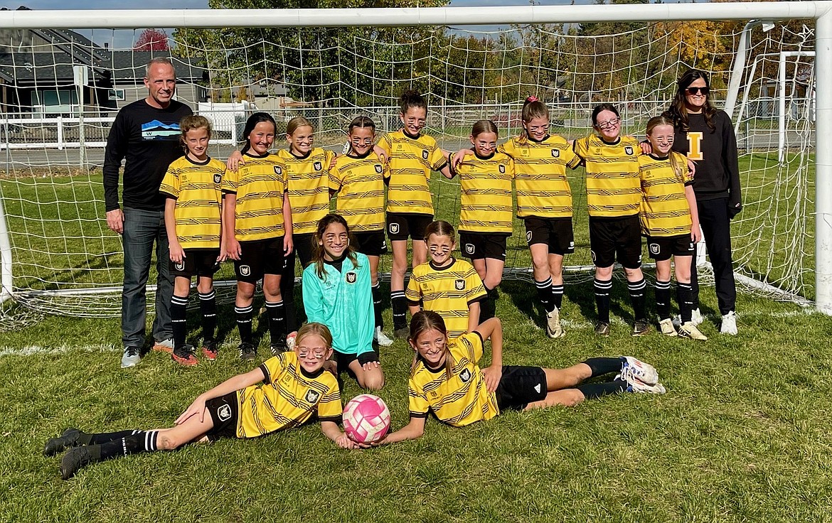 Courtesy photo
The 2014 Sting (black) girls soccer team finished the season with a 4-0 win against Spokane Shadow N Shale. Sting goals scored by Aida Stanley, Finley Martin and Quinn Baily. In the front from left are Rylan Parks and Audrey Rietze; kneeling from left are Sophia Moreno and Brooklyn Simoni; and back row from left, coach Ken Thompson, Emma Thompson, Poppy Moreau, Aida Stanley, Finley Martin, Liv Mickelson, Quinn Baily, Elsie Hewitt-Nord, Lyla Maestas, Charli Mehlhoff and coach Katie Martin.