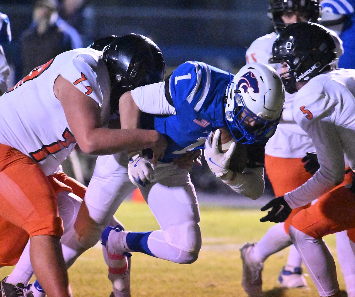 Kris Davis rumbles for extra yards against Ronan.