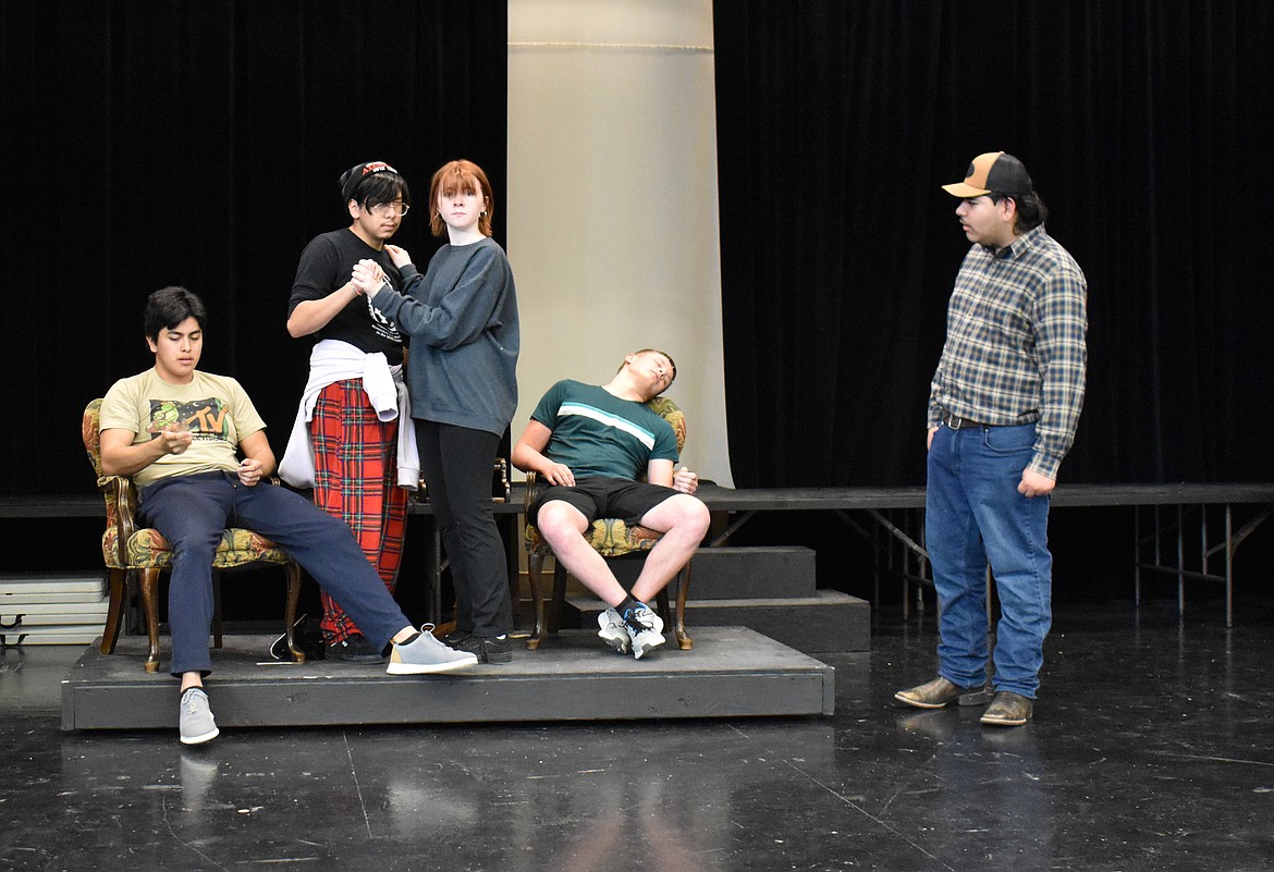 Mr. Green (Miguel Vilchis), Professor Plum (Enrique Perez) and Miss Scarlet (Emma Leavitt) pretend to be intoxicated to keep a cop (Christopher Acosta), right, from finding out that a motorist (Parker Freeman) is just plain dead in a rehearsal of the Othello High School production of “Clue.”