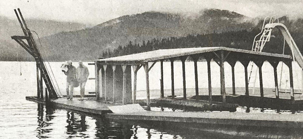 In 1984, Dave Mix, right, is accompanied by a television cameraman on a Hayden Lake dock.