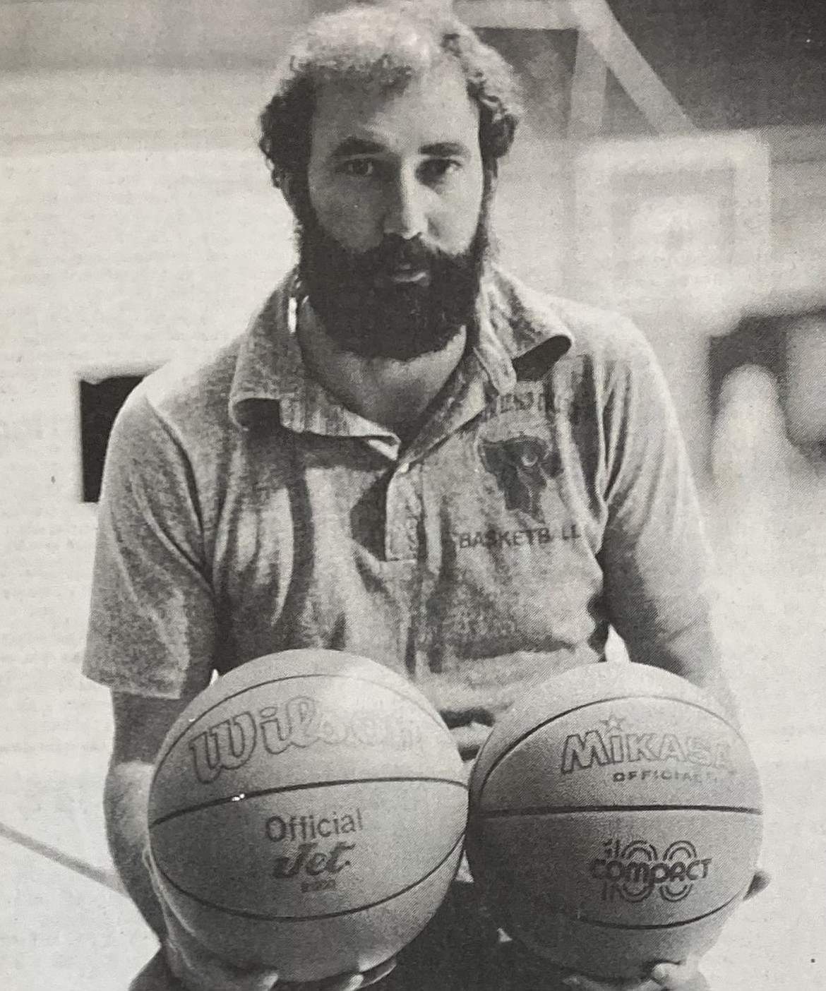 In 1984, North Idaho College coach Greg Crimp adjusts to the size of the new women’s basketball.