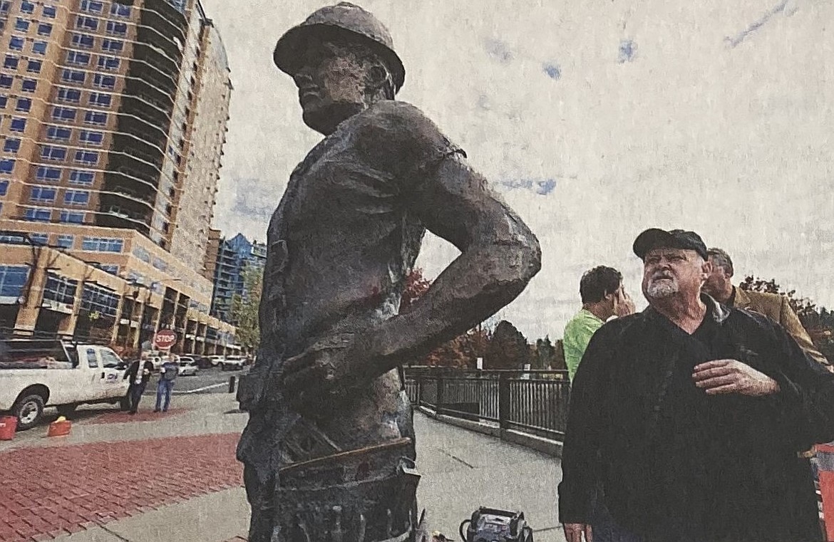 In 2014, artist Terry Lee inspects his statue, “The American Worker.”