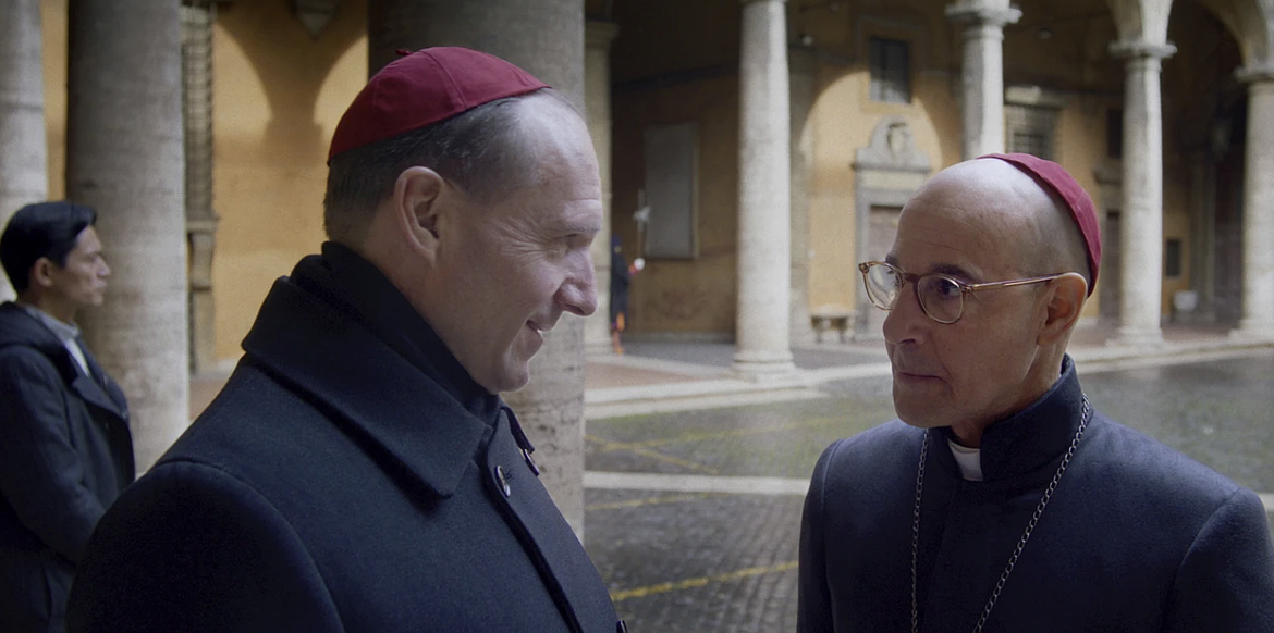 This image released by Focus Features shows Ralph Fiennes and Stanley Tucci, right, in a scene from "Conclave."