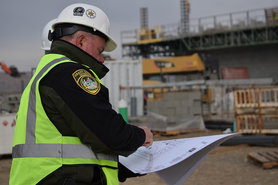 Grant County Sheriff Joey Kriete explains aspects of the drawing being used to construct the new Grant County Jail. A lot of thought has gone into ensuring officer and inmate safety at the facility and that shows through in the design, he said.