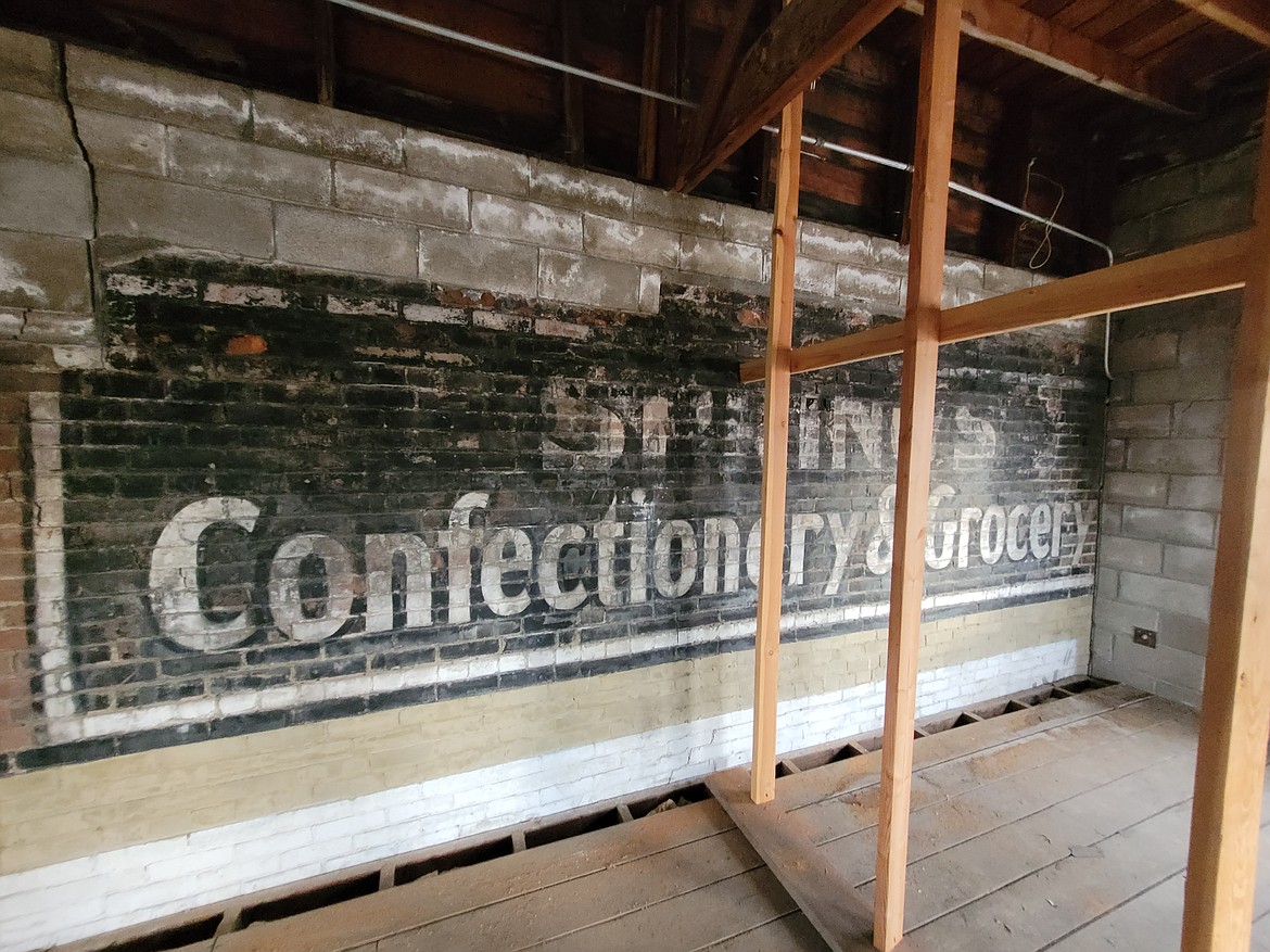 A fading phantom sign that was once on an external wall is a reminder that a confectionary and grocery store was once housed in the Fort Ground Grill building. The sign is pictured Monday from the room above the old tavern, accessible only by ladder.