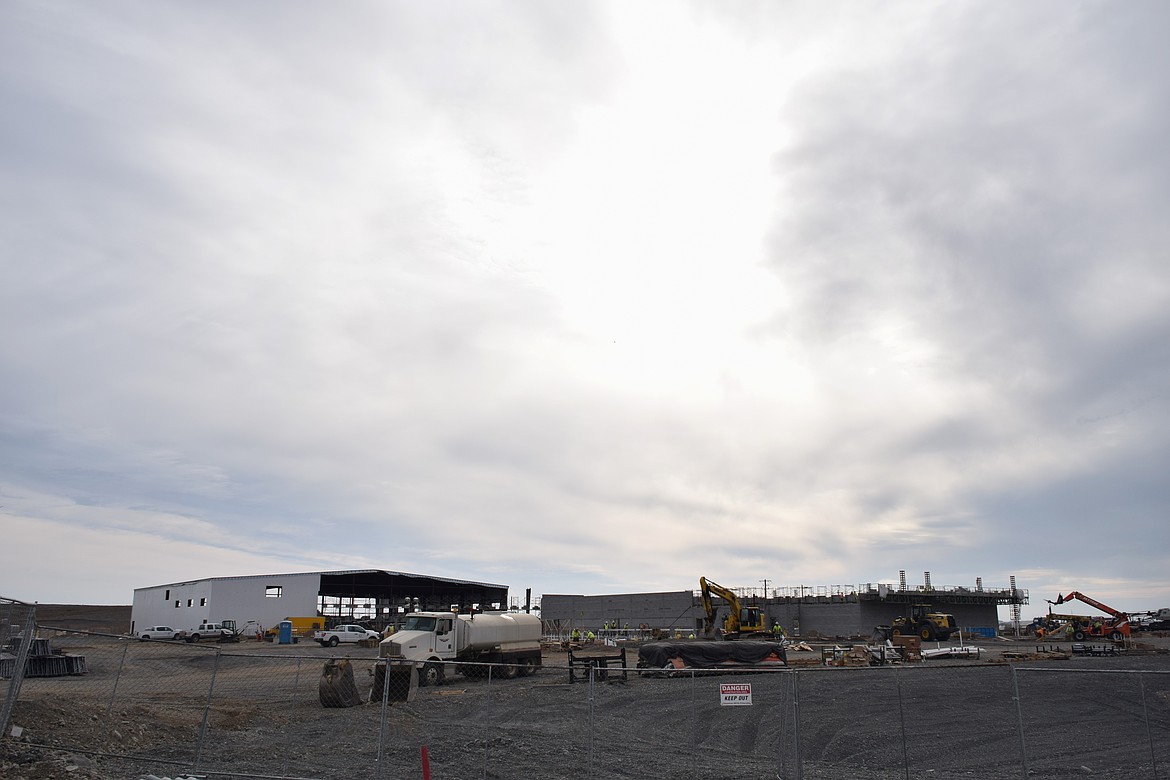 The white building on the left in this photo is one of two that will be built to house inmates in multiple pods. The pods will have technology that allows the inmates to be closely monitored and walls that separate inmates based on risks of interaction with one another and officers.