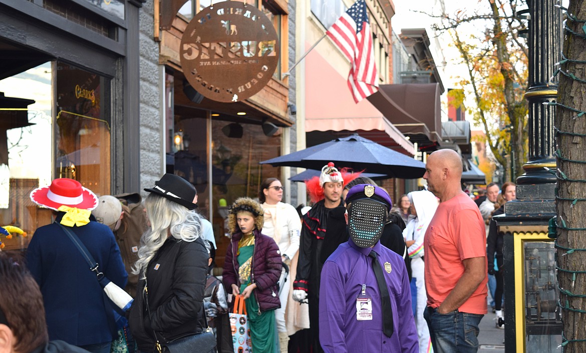 Sherman Ave. in downtown Coeur d'Alene was packed with hundreds of trick-or-treaters visiting local businesses on Thursday night.