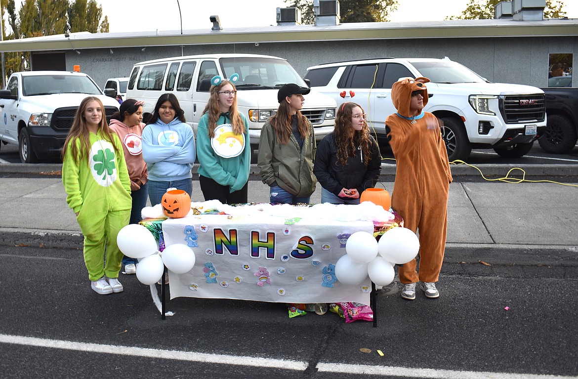 The Ephrata High School chapter of the National Honor Society awaits the next rush of candy-seekers at Ephrata’s downtown trick-or-treat event Thursday. From left: Erika Morford, Aryz Navarro, Dayana Nalasco, Baylie Broesch, Adelyn Simmons, Emma Padilla and Charles Flynn