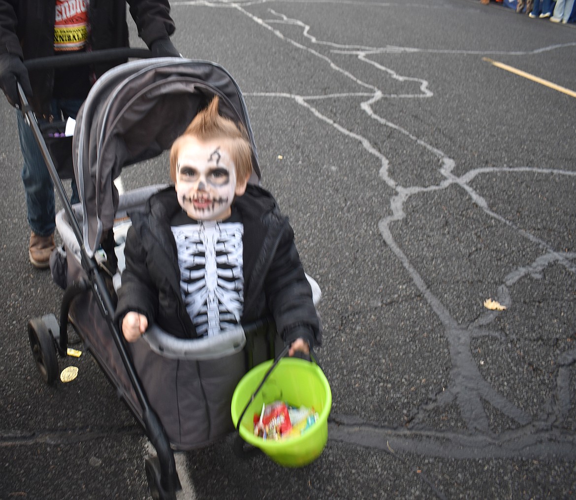 Three-year-old Aiden Winfrey does his best to be frightening at Ephrata’s downtown trick-or-treat event Thursday.